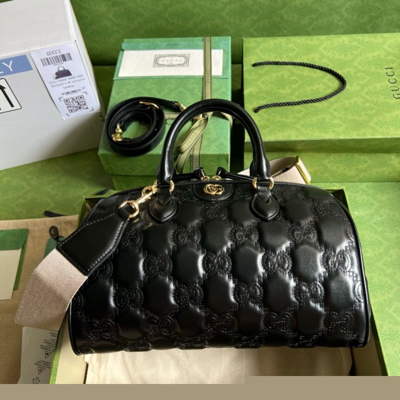 G*u*i top handle bags